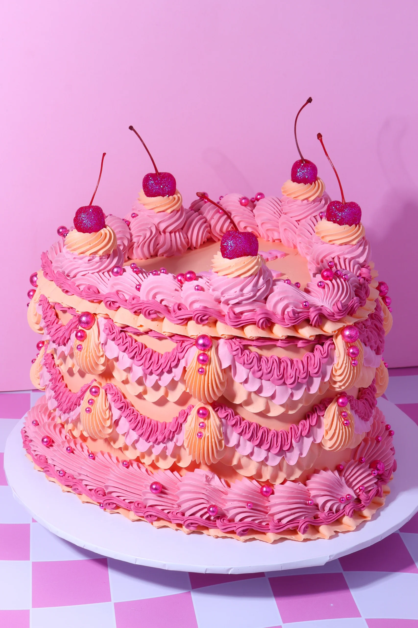 Elaborate layered pink Lambeth cake
