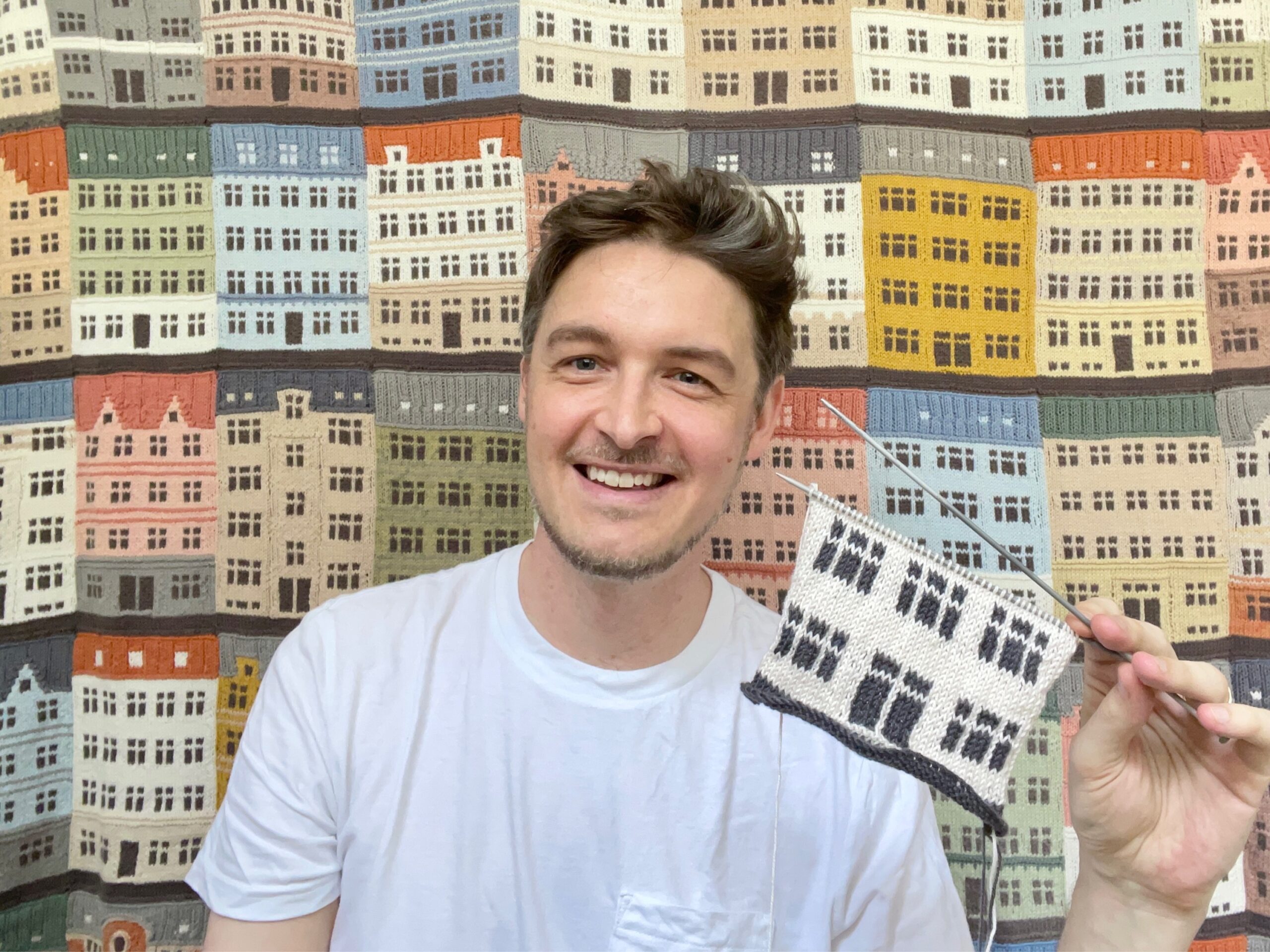 Jake Henzler running a knitting workshop in Copenhagen